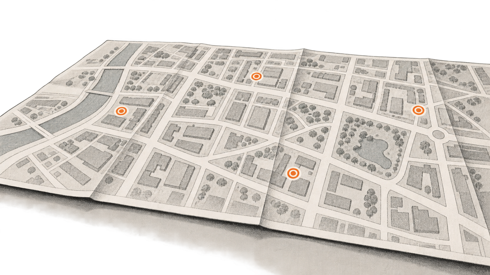 Conceptual charcoal illustration of a generic folded street map with four separate orange location markers.
